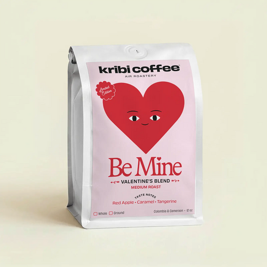 Kribi Coffee Valentine's Blend packaging with a heart design on a beige background