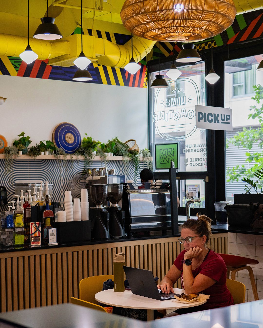 A guest working on a laptop at our Oak Park cafe
